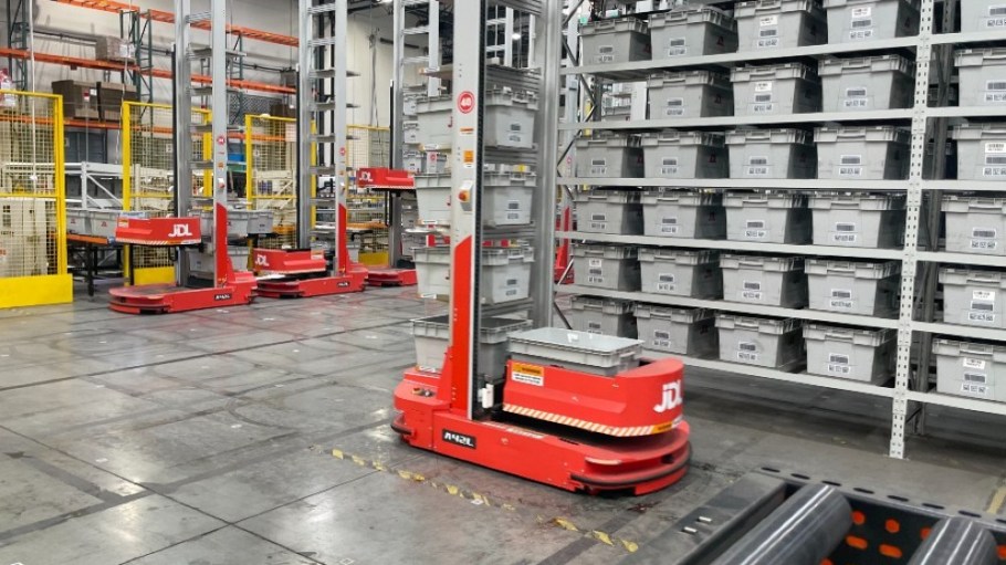 A robot moves bins filled with product at JD Logistics' automated warehouse in Fontana, Calif.