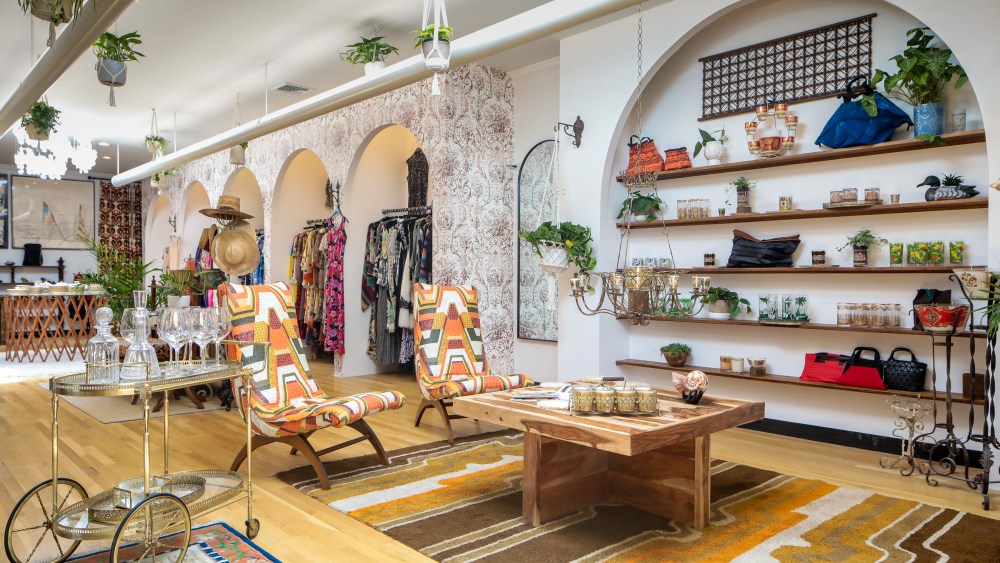 A pan of Morphew's Southampton store featuring a brass bar cart, psychedelic loungers and more home goods, with vintage fashion in the back.