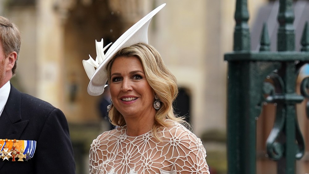 LONDON, ENGLAND - MAY 06: King Willem-Alexander of the Netherlands (left) and Queen Maxima of the Netherlands arriving at Westminster Abbey  ahead of the coronation ceremony of King Charles III and Queen Camilla on May 6, 2023 in London, England. The Coronation of Charles III and his wife, Camilla, as King and Queen of the United Kingdom of Great Britain and Northern Ireland, and the other Commonwealth realms takes place at Westminster Abbey today. Charles acceded to the throne on 8 September 2022, upon the death of his mother, Elizabeth II. (Photo by Andrew Milligan - WPA Pool/Getty Images), Dutch designer Jan Taminiau, she wore a bespoke white dress.