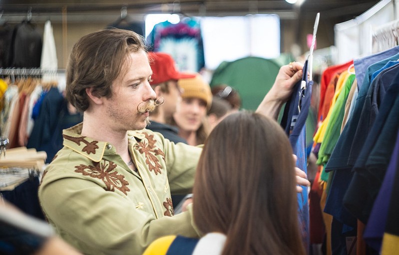 A visitor browses the racks at ThriftCon Denver in April.