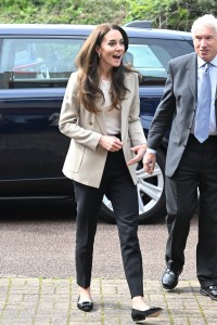 Kate kept it casual in a Reiss blazer, LK Bennett trousers, and Boden flats for a visit to a baby bank.