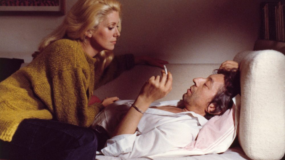 Catherine Deneuve with Serge Gainsbourg on the set of Claude Berri's 1980 movie "I Love You All," shot by Georges Pierre.