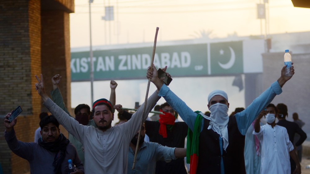Demonstrators are seen as Pakistani police use teargas shells against the supporters of Former Prime Minister Imran Khan and political party Pakistan Tehreek-e-Insaf (PTI) during a protest held against the arrest of their leader Imran Khan, in Peshawar, Pakistan on May 09, 2023.