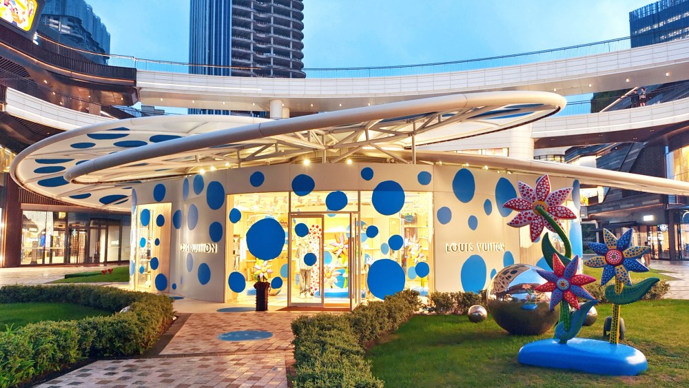A Yayoi Kusama simulation robot and "dancing pumpkin" are displayed at the Louis Vuitton store in Shanghai, China, May 17, 2023.