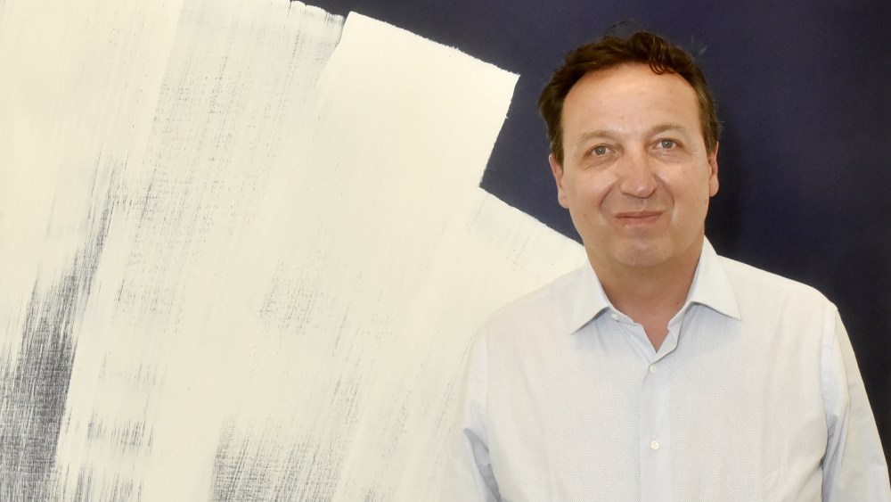 PARIS, FRANCE - JUNE 12: Gallerist Emmanuel Perrotin poses with A work of Hans Hartung during "Hartung 80 " Press Preview at Galerie Perrotin on June 12, 2021 in Paris, France. (Photo by Foc Kan/WireImage)
