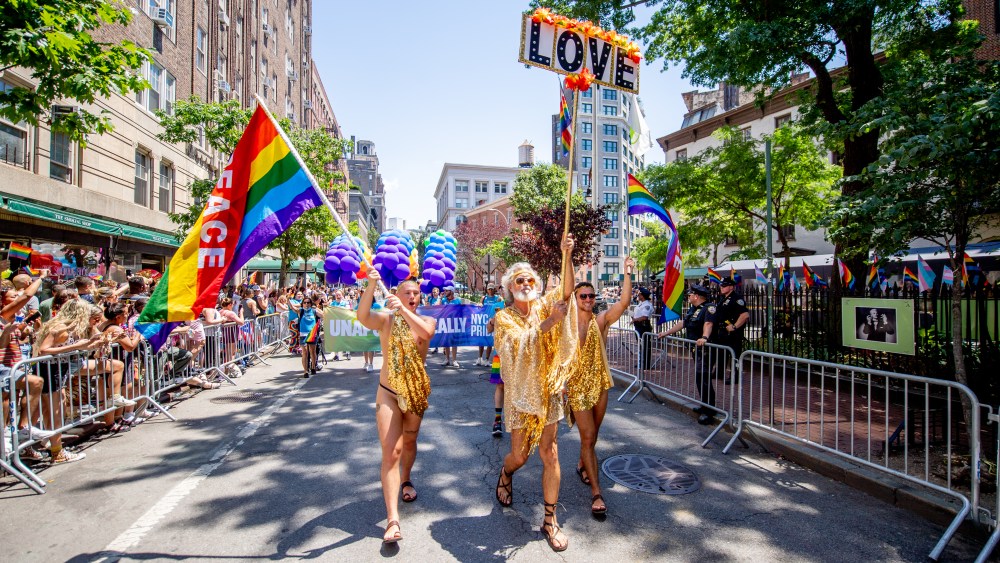 NEW YORK, NEW YORK - JUNE 26: People in pride colors attend and march in front of the Stonewall Inn during the 2022 New York City Pride March on June 26, 2022 in New York City. (Photo by Roy Rochlin/Getty Images)