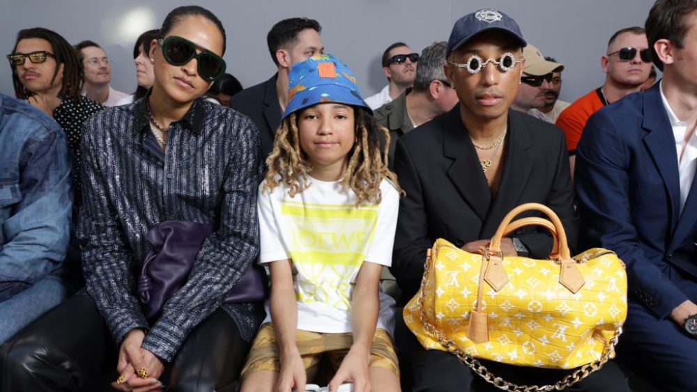 Helen Lasichanh, Rocket Williams and Pharrell Williams attend the Loewe menswear spring 2024 show on June 24 in Paris.