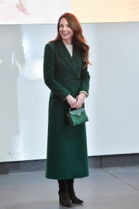 To launch her “Shaping Us” campaign, Kate wore a Victoria Beckham dress topped with an Alexander McQueen coat and accessorized with Gianvito Rossi boots and a Manu Atelier bag.
