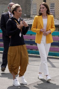 Kate wore an LK Bennett jacket over a white top and trousers, paired with Veja sneakers at an engagement for Mental Health Awareness Week.