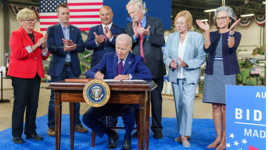 Pres. Biden signs an executive order at AMI in Auburn, Maine.