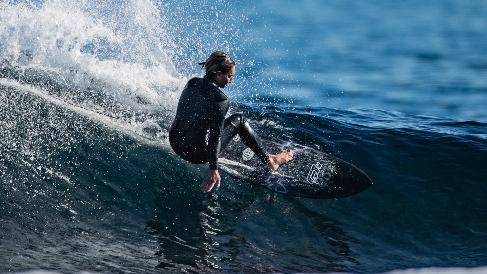 German American pro surfer Frankie Harrer wears a wetsuit from the Haydenshapes Rubber by Dion Lee capsule collection, which launches August 1st.