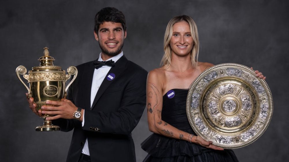 Carlos Alcaraz holding the Gentlemen's Singles Trophy and Marketa Vondrousova posing with the Venus Rosewater Dish at the Wimbledon Champions Dinner on July 16 in London.