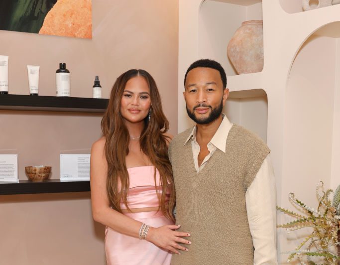(L-R) Chrissy Teigen and John Legend at the Loved01 by John Legend pop-up launch on July 20 in Los Angeles.