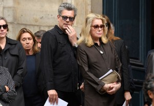 French singer Benjamin Biolay (CL) and French actress Catherine Deneuve (CR) react at the end of the funeral ceremony for late British-French singer and actress Jane Birkin in the Saint-Roch church in Paris on July 24, 2023. British-French singer and actress Jane Birkin died at 76, it was announced on July 16, 2023. (Photo by JULIEN DE ROSA / AFP) (Photo by JULIEN DE ROSA/AFP via Getty Images)