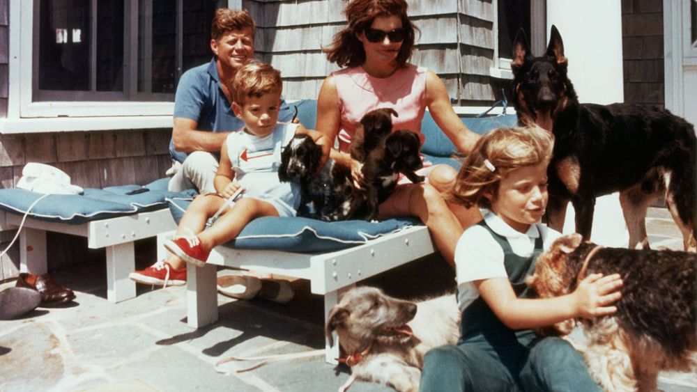 The first family on the patio of their Squaw Island House in Hyannisport, Massachusetts, with several puppies and dogs. (Photo by © CORBIS/Corbis via Getty Images)