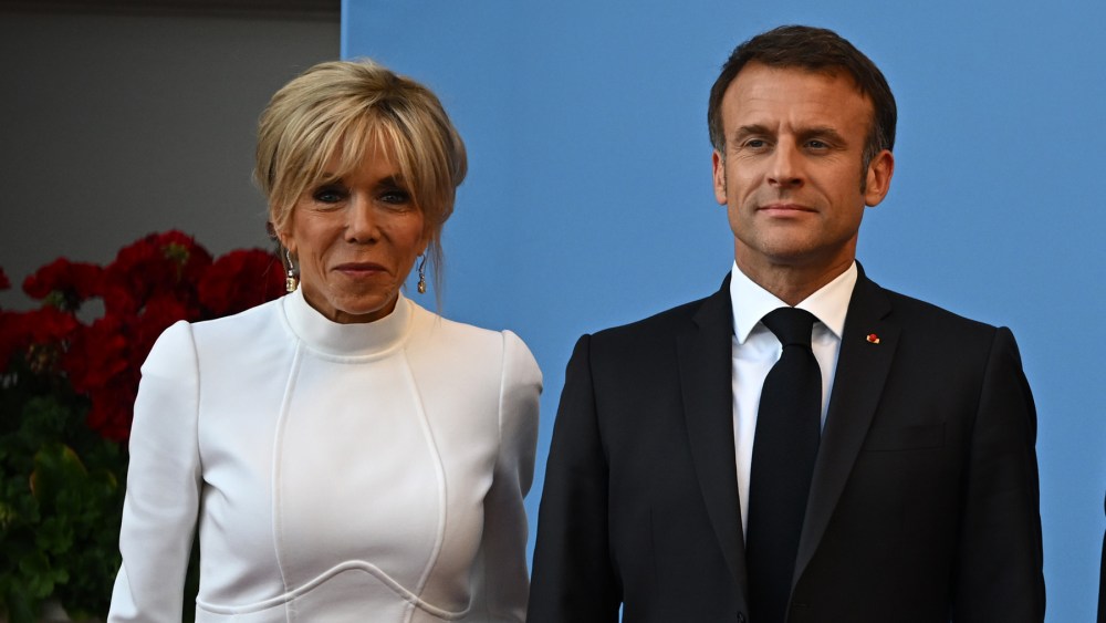 VILNIUS, LITHUANIA - JULY 11: (L-R) French President Emmanuel Macron and his wife Brigitte Macron, Lithuania's President Gitanas Nauseda and his wife Diana Nausediene pose upon arrival at the social dinner during the NATO Summit, on July 11, 2023 in Vilnius, Lithuania. The summit is bringing together NATO members and partner countries heads of state from July 11-12 to chart the alliance's future, with Sweden's application for membership and Russia's ongoing war in Ukraine as major topics on the summit agenda. (Photo by Paul Ellis - Pool/Getty Images)