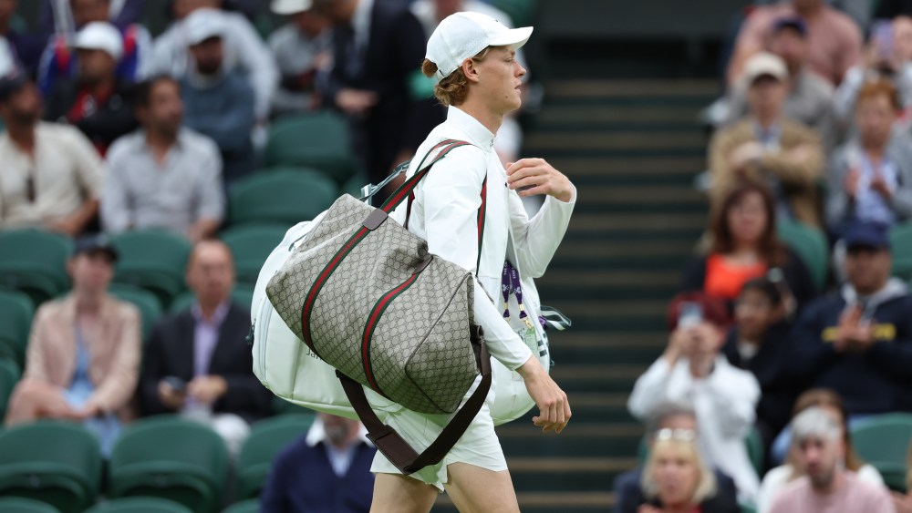 Jannik Sinner walks onto Centre Court at The Wimbledon’s Championships carrying a custom designed Gucci duffel bag.