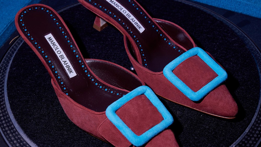 Manolo Blahnik’s Maysalebius red and light blue suede buckle mules.