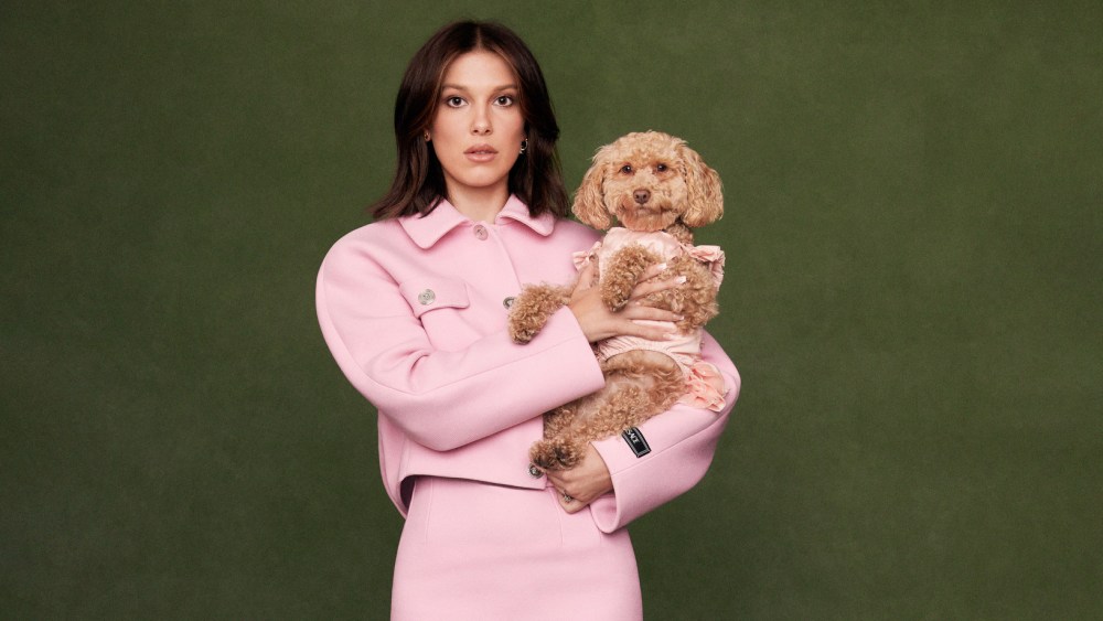 Versace’s wool cropped jacket and pencil skirt. Gianvito Rossi pumps. Oliver Blandi Diamond Burst Mini Burst stud; Eéra 18-karat gold with white diamond pavé earring; Millie Bobby Brown’s own engagement ring.