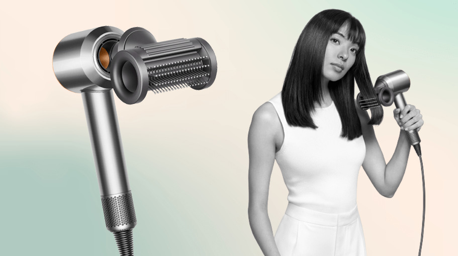 hair dryer with attachment; woman using hair dryer