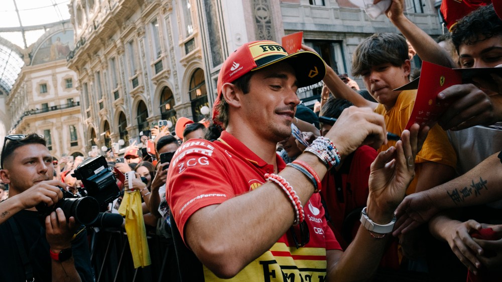 Charles Leclerc with fans outside the Ferrari store in Milan.
