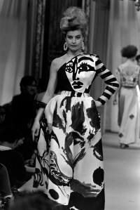 Model Marie Seznec on the runway at the Patou Spring 1986 Couture Fashion Show in a,Dali-esque hand painted ballgown designed by Christian Lacroix.