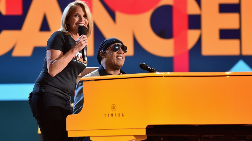SANTA MONICA, CA - SEPTEMBER 07: Katie Couric (L) and Stevie Wonder perform onstage at the sixth biennial "Stand Up to Cancer" (SU2C) telecast at the Barker Hangar on Sept. 7, 2018 in Santa Monica, California. (Photo by Alberto E. Rodriguez/Getty Images for Stand Up To Cancer)