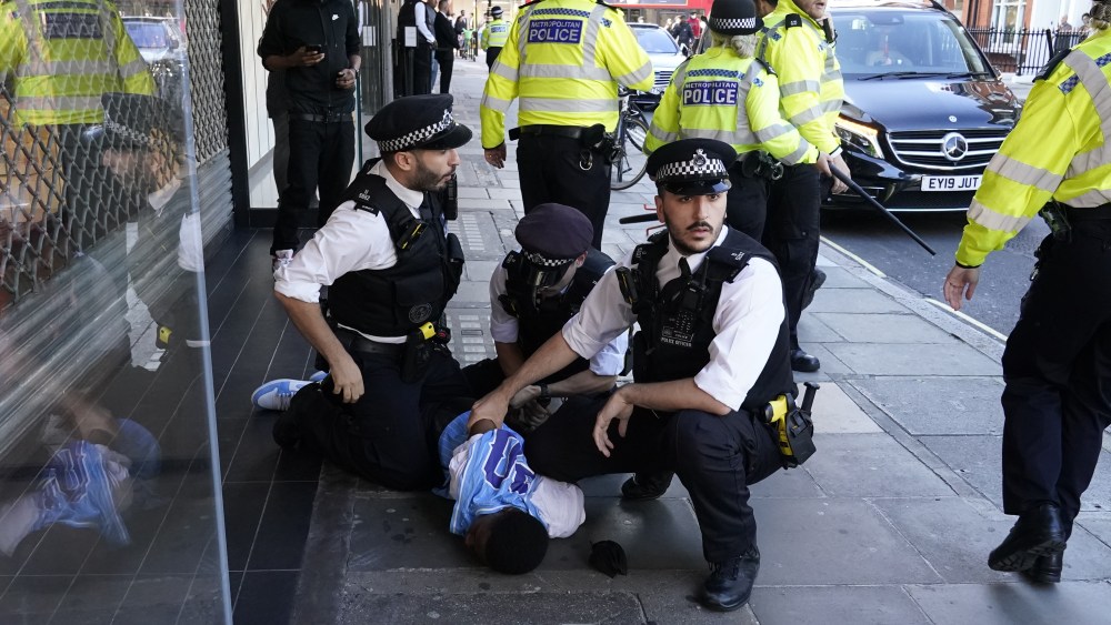 Police officers detain a man near Oxford Street in central London, after viral TikTok videos urged youngsters to rob the JD Sports store on Oxford Street.