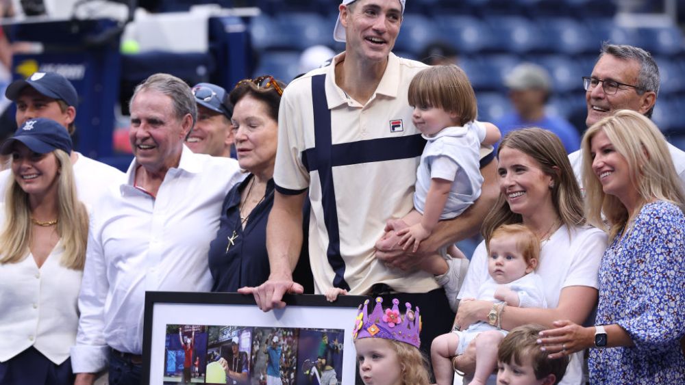 John Isner of the United States celebrates match point with his family against Facundo Diaz Acosta of Argentina during their Men's Singles First Round match on Day Two of the 2023 US Open at the USTA Billie Jean King National Tennis Center on August 29, 2023 in the Flushing neighborhood of the Queens borough of New York City.