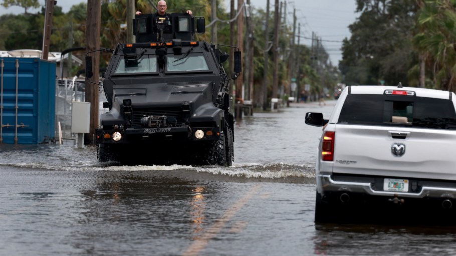 A rescue vehicle drives through a flooded street after Hurricane Idalia passed offshore on August 30, 2023 in Hudson, Florida.