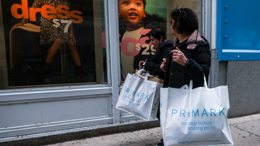 Customers carry Primark bags in Chicago on Oct. 14, 2022.