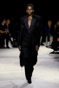 Model on the runway at Alexander McQueen Ready To Wear Spring 2024 held at Careau du Temple on September 30, 2023 in Paris, France.