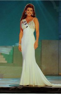 Ali Landry, 22 and representing the US at the 1996 Miss Universe Pageant, appears in front of judges during the evening gown portion of the 1996 Miss Universe Pageant 14 May at the Aladdin Theater for the Performing Arts in Las Vegas. The 1996 Pageant will take place 17 May, and contestants from 79 countries are scheduled to participate.    AFP PHOTO ho/Miss Universe (Photo credit should read MISS UNIVERSE/ho/AFP via Getty Images)