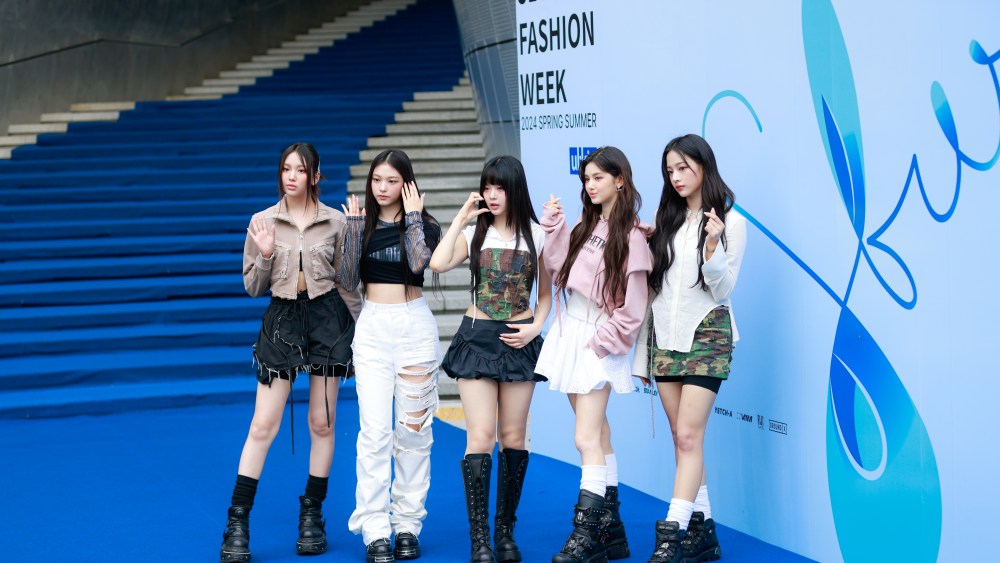 Minji, Hanni, Danielle, Haerin, and Hyein of NewJeans pose at the Ul:kin show during Seoul Fashion Week at DDP in Seoul, South Korea.