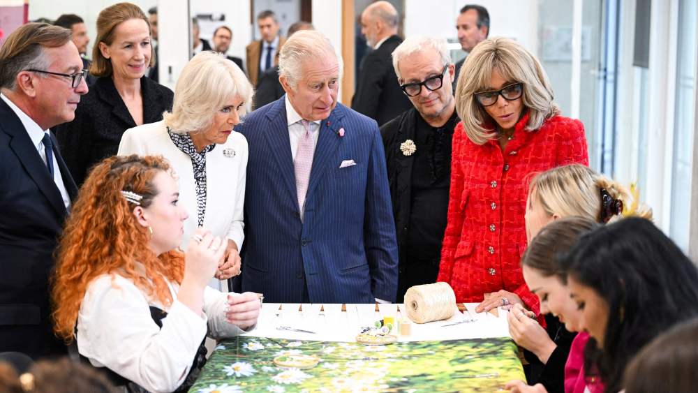 Britain's Queen Camilla, Britain's King Charles III, French President's wife Brigitte Macron (R), next to Bruno Pavlovsky, president of Chanel and 19M, visit the 19M Campus, founded by French luxury fashion house Chanel, in Paris on September 21, 2023. Britain's King Charles III and his wife Queen Camilla are on a three-day state visit starting on September 20, 2023, to Paris and Bordeaux, six months after rioting and strikes forced the last-minute postponement of his first state visit as king. (Photo by Bertrand GUAY / POOL / AFP) (Photo by BERTRAND GUAY/POOL/AFP via Getty Images)