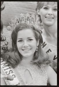 (Original Caption) A radiant Dorothy Anstett of Kirkland, Washington, poses with her newly won Miss USA trophy. She will enter the Miss Universe contest in July as representative of the United States. Miss USA is one of eight sisters and brothers, is 20 years old, measures 40-25-36 and is 5 ft. 9 in. tall and weighs 127 pounds. She has brown hair and brown eyes.