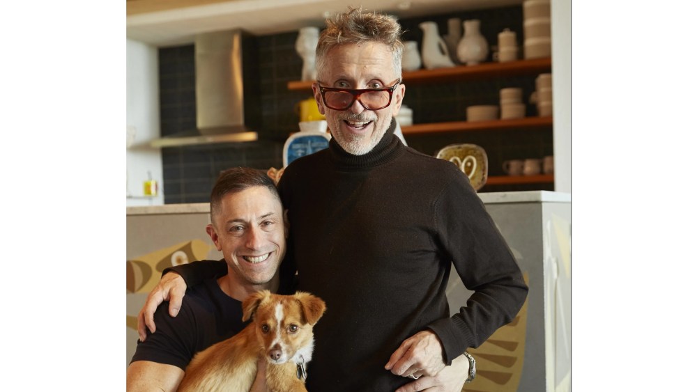 Jonathan Adler and Simon Doonan pose with their dog FoxyLady.