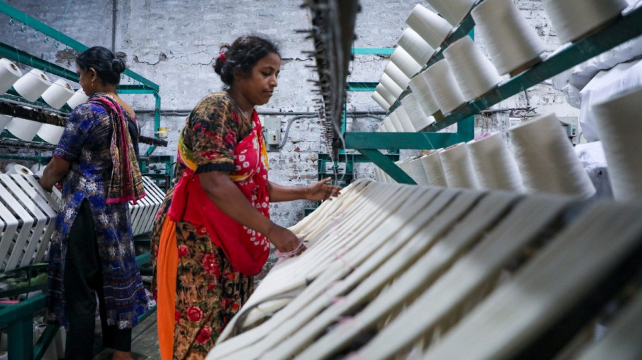 Workers manufacture thread for Ready-Made Garment Industry in a textile mill in Narayanganj outskirts of Dhaka, Bangladesh on September 02, 2023.