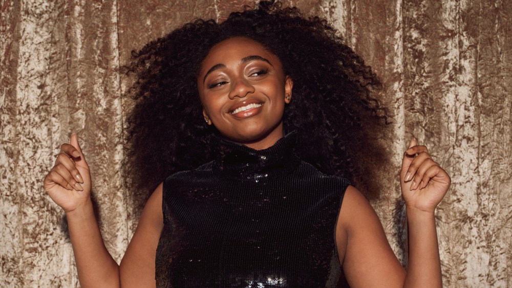 Samara Joy featured in Theory's holiday campaign.