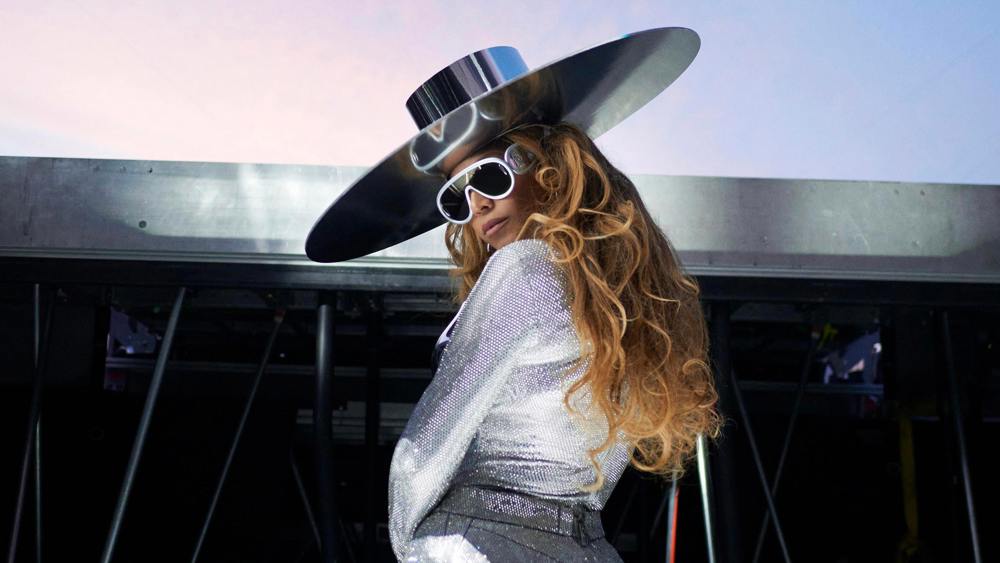 Beyoncé wearing Loewe and a silver boater