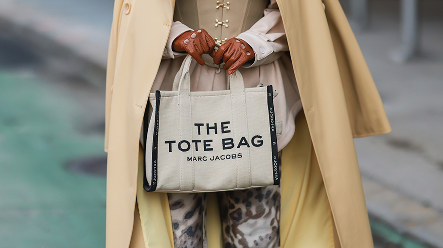 Woman holding a Marc Jacobs tote bag