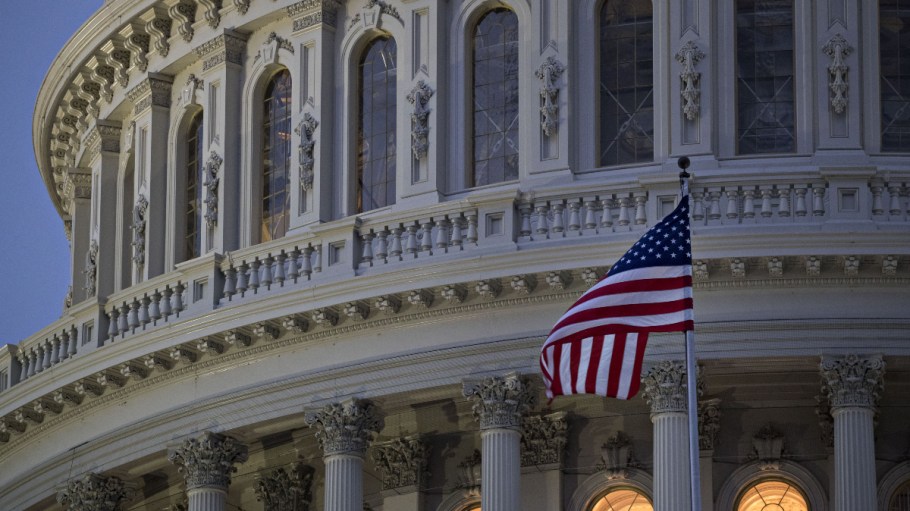The American flag flies outside the U.S. Capitol building in Washington, D.C.