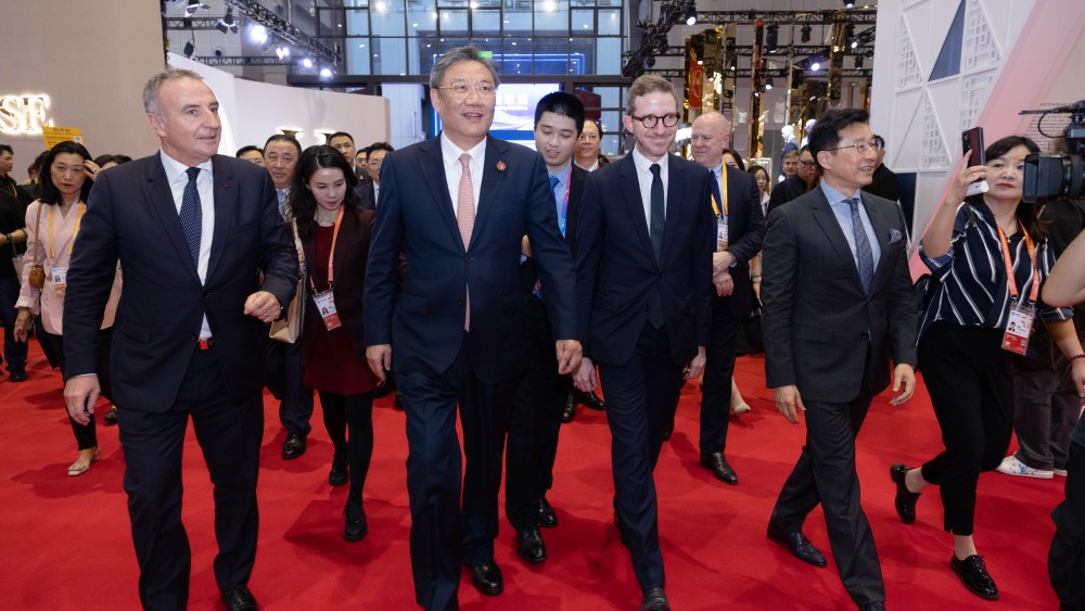 LVMH delegates and China's commerce minister Wang Wentao at the LVMH pavilion during the 6th edition of CIIE in Shanghai, China.