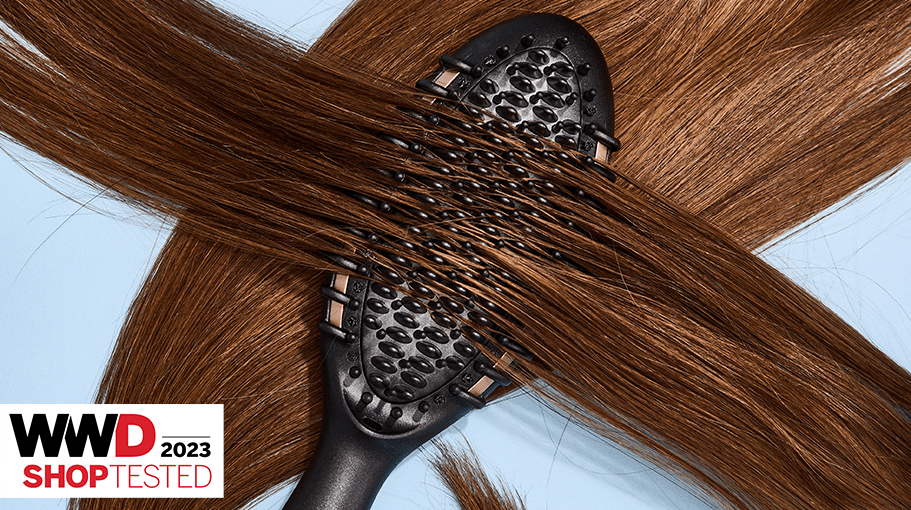 Hair straightening brush on brunette hair