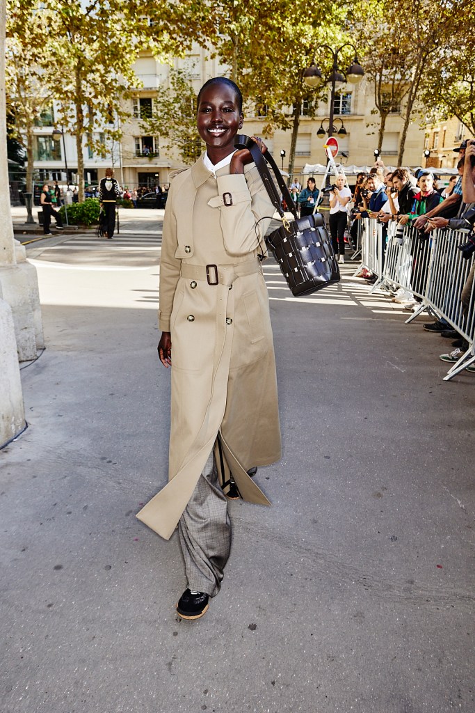 A model at Stella McCartney's spring 2024 show carrying a bag made from upcycled grape waste.