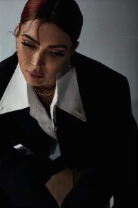 AnOnlyChild cotton and nylon button-down shirt and polyester and viscose trousers; The Frankie Shop’s polyester blazer; Pamela Love necklace; Jacquie Aiche earrings.