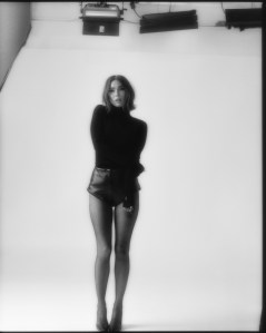 Jacob Lee cashmere turtleneck; David Koma napa leather mini shorts; Gianvito Rossi pumps; Wolford tights.