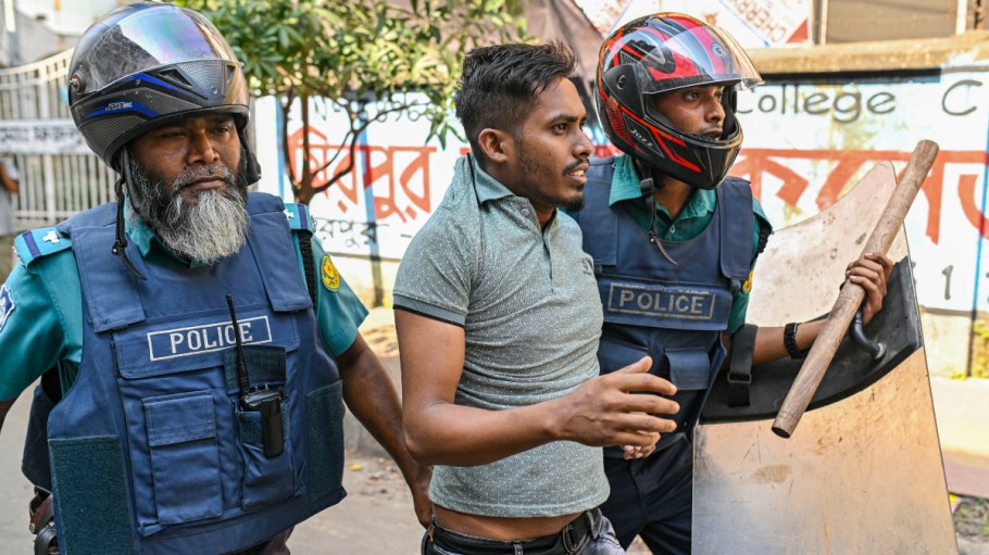 Bangladesh police arrested a garment worker blocking the road during a protest demanding a wage increase in Dhaka, Bangladesh, on November 02, 2023. Hundreds of garment factories in Bangladesh have shuttered as thousands of workers staged violent protests to demand a near-tripling of their wages, police said on November 2.
