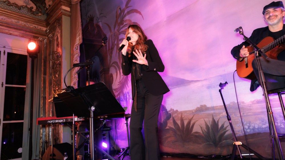 Carla Bruni performing at the Valextra dinner in Paris.