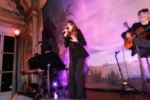 Carla Bruni performing at the Valextra dinner in Paris.